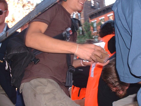 D_organizers_handing_out_cargo_cellphones.jpg